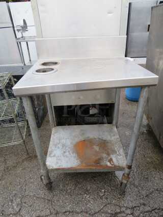 One Stainless Steel Table With Under Shelf And Back Splash On Casters. 2 Cutouts 4-1/4. 27X24X43.