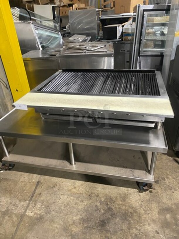 Bakers Pride Commercial Countertop Natural Gas Powered 48 Inch Char Broiler Grill! On Commercial 60 Inch Equipment Stand! With Underneath Storage Space! All Stainless Steel! Model XX8 Serial 592381707002! On Casters! Working When Removed!