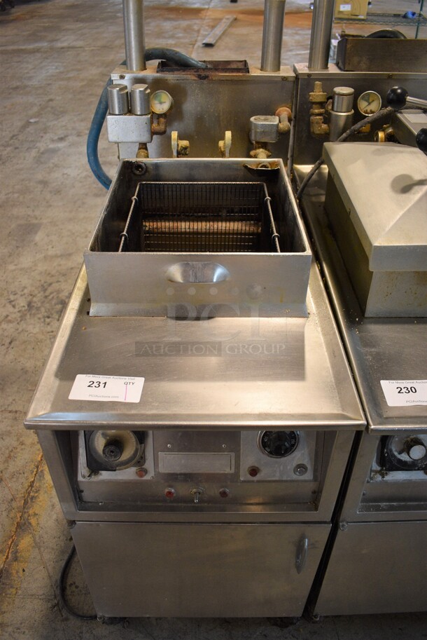 Henny Penny Model 600 Stainless Steel Commercial Floor Style Natural Gas Powered Pressure Fryer w/ Fry Basket on Commercial Casters. Missing Top Piece. 18x39x50