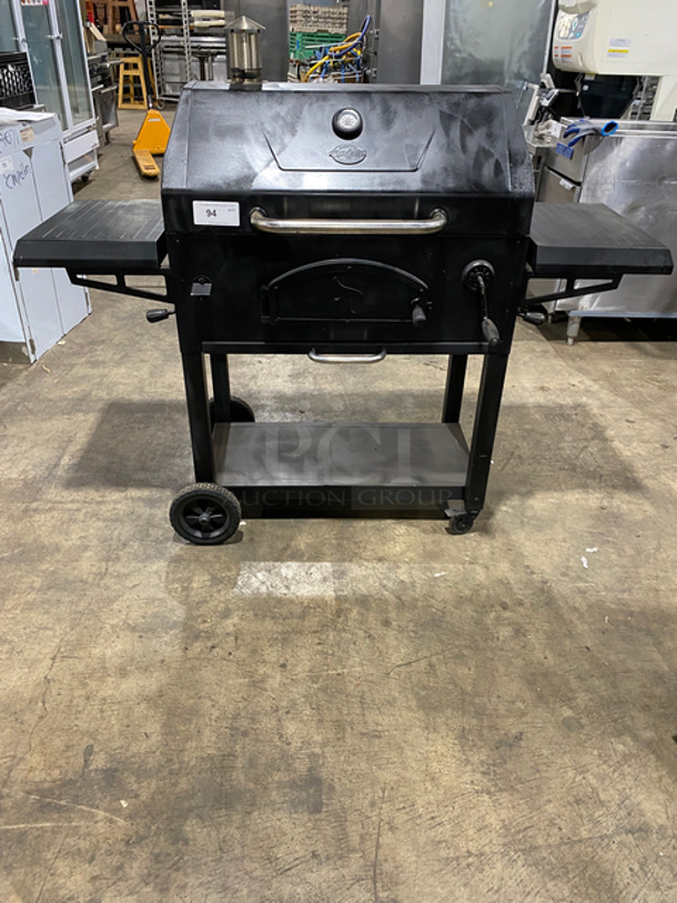 BEAUTIFUL! AMAZING FIND! Char Griller Heavy Duty Charcoal Grill/ Smoker! With Front Charcoal Access Door! Built In Bottle Opener! Dual Sided Tables! Hinged Lid! With Storage Space Underneath! Heavy Duty Steel! On Casters!