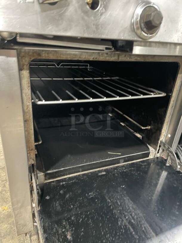 Nice! All Stainless Steel Natural Gas Powered Combo Range! 2 Burner With 36 Inch Flat Top  Griddle! With Two Ovens Underneath! On Commercial Casters! - Image 9 of 10