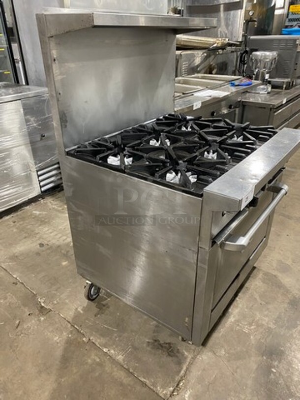 Garland Commercial Natural Gas Powered 6 Burner Stove! With Raised Back Splash And Salamander Shelf! With Oven Underneath! Metal Oven Rack! All Stainless Steel! On Casters! - Image 2 of 10