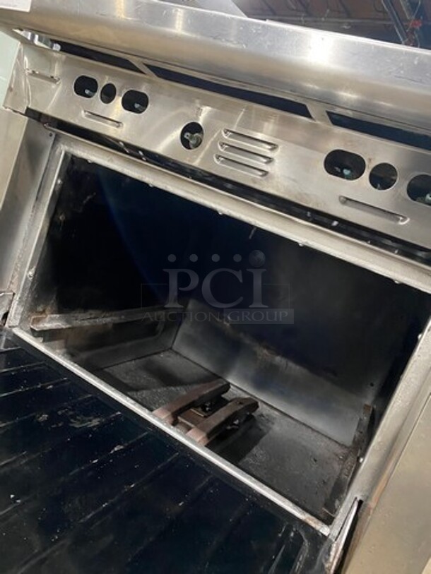 Garland Commercial Natural Gas Powered 4 Burner Stove! With Oven Underneath! With Raised Backsplash! All Stainless Steel! Model M44R Serial 130600101753! On Legs! - Image 7 of 9