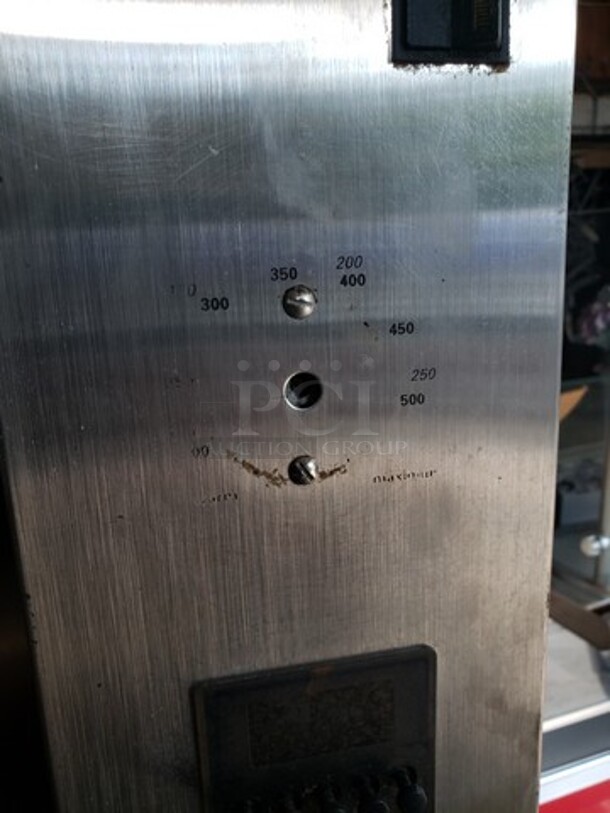 Hickory 10.10E Electric Rotisserie Oven on Casters! Left side of the oven has a small dent. Missing one knob and one knob is broken and needs to be replaced. 

Motor 120V, 1PH
Heating Elements 208V, 3PH - Image 8 of 10