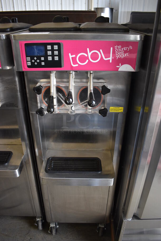 2013 Stoelting Model F231-309I2-AD1 Stainless Steel Commercial Floor Style Air Cooled 2 Flavor w/ Twist Soft Serve Ice Cream Machine on Commercial Casters. 208-240 Volts, 3 Phase. 