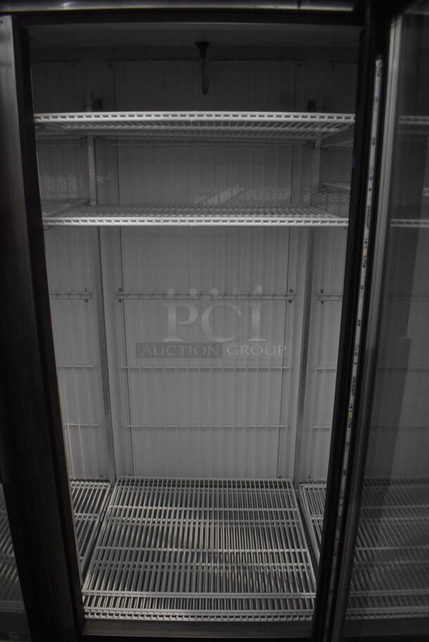 2014 True GDM-72F-LD Commercial Free Standing Electric Powered Triple Swing Glass Door Merchandiser Freezer In Black With Polycoated Racks. 115V/1 Phase Could Not Test Due To Different Plug Style - Image 6 of 8