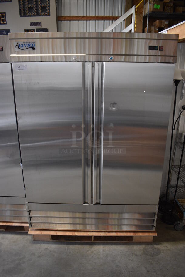 BRAND NEW SCRATCH AND DENT! Avantco Model 178SS2FHC Stainless Steel Commercial Two Door Reach In Freezer w/ Poly Coated Racks on Commercial Casters. 115 Volts, 1 Phase. 54x32x77.5. Tested and Working! - Image 1 of 7