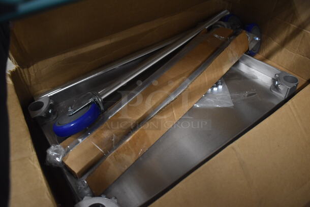BRAND NEW IN BOX! Stainless Steel Table w/ Under Shelf and 3 Legs on Commercial Casters. Includes 27x17x2 - Image 1 of 3