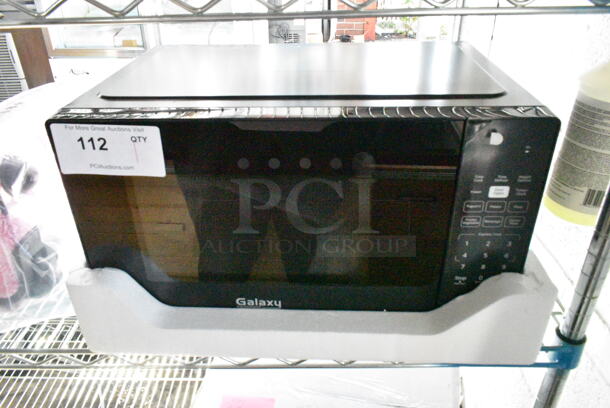 BRAND NEW SCRATCH AND DENT! 2024 Galaxy 177MW900D0A Office Series Microwave with Push Button Controls. 120 Volts, 1 Phase.  - Image 2 of 5