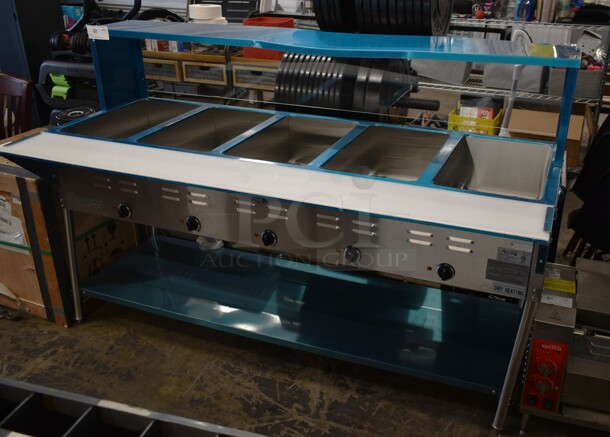 BRAND NEW SCRATCH AND DENT! Avantco 17STE5S Stainless Steel Commercial Floor Style Electric Powered 5 Bay Steam Table w/ Sneeze Guard and Under Shelf. 208/240 Volts, 1 Phase. 