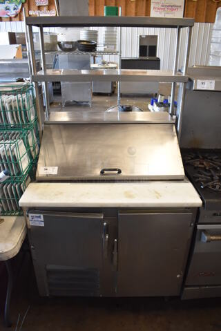 Leader Stainless Steel Commercial Sandwich Salad Prep Table Bain Marie Mega Top w/ 2 Tier Over Shelf and Various Drop In Bins. 115 Volts, 1 Phase. 36x35x70. Tested and Powers On But Does Not Get Cold