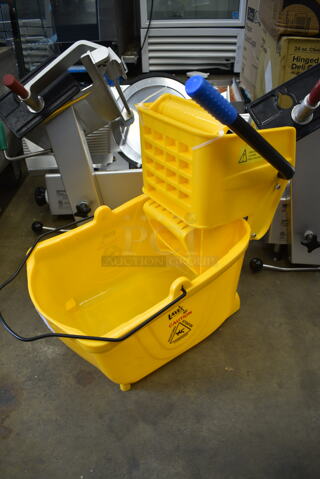 Lavex Yellow Poly Mop Bucket w/ Wringing Attachment and Commercial Casters. 