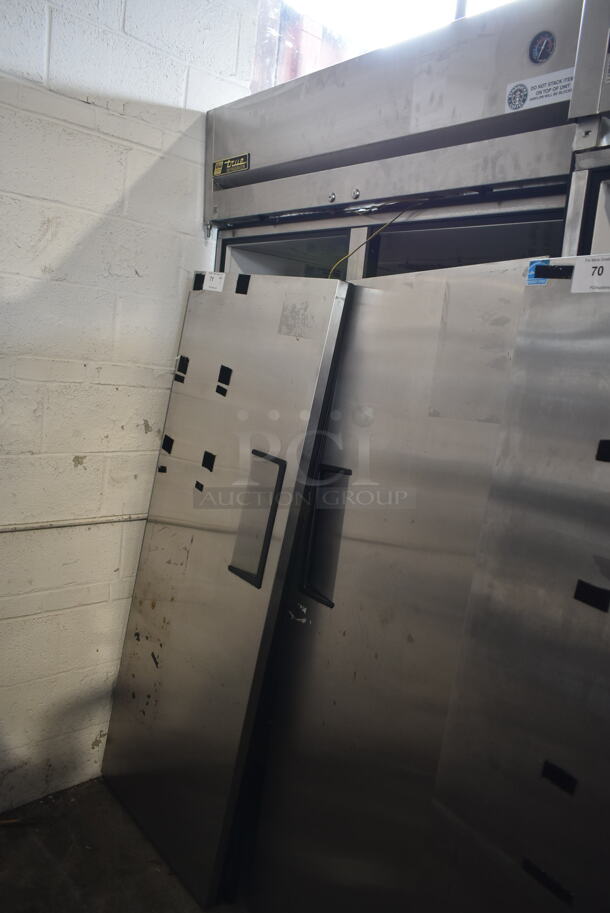 2014 True TG2R-2S ENERGY STAR Stainless Steel Commercial 2 Door Reach In Cooler w/ Poly Coated Racks on Commercial Casters. Doors Need To Be Reattached. 115 Volts, 1 Phase. Tested and Powers On But Does Not Get Cold - Image 1 of 8