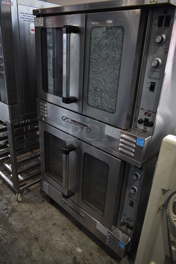 2 Southbend ENERGY STAR Stainless Steel Commercial Electric Powered Full Size Convection Ovens w/ View Through Doors, Metal Oven Racks and Thermostatic Controls. See Pictures for Glass Damage on Top Oven Door. 208 Volts, 3 Phase. 2 Times Your Bid!