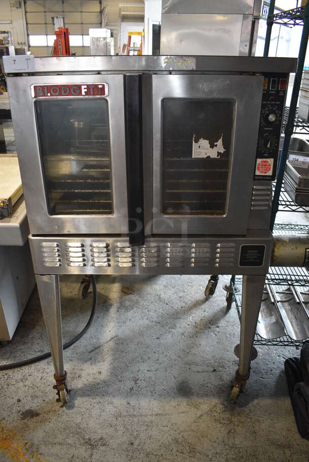 Blodgett Stainless Steel Commercial Natural Gas Powered Full Size Convection Oven w/ View Through Doors, Metal Oven Racks and Thermostatic Controls on Metal Legs w/ Commercial Casters. 38x40x61