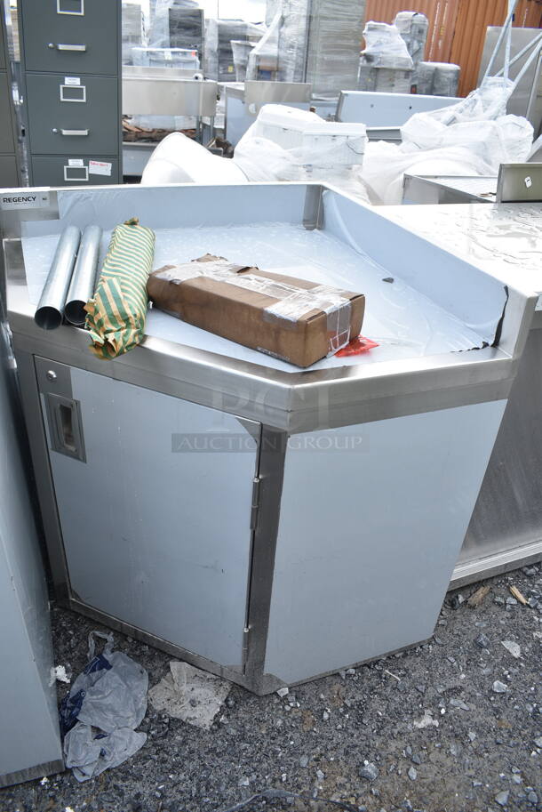 BRAND NEW SCRATCH AND DENT! Regency Spec Line Stainless Steel Commercial 30" x 30" 14 Gauge Stainless Steel Corner Work Table with Hinged Door and Lock - Image 2 of 7