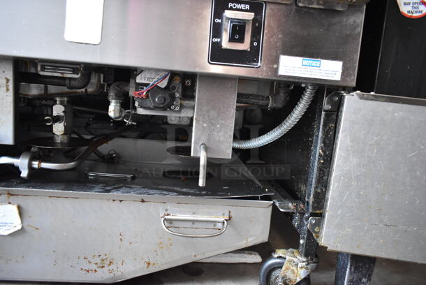 2020 Henny Penny OGA-323 ENERGY STAR Stainless Steel Commercial Natural Gas Powered 3 Bay Fryer w/ 3 Metal Fry Baskets on Commercial Casters. 255,000 BTU.  - Image 8 of 12