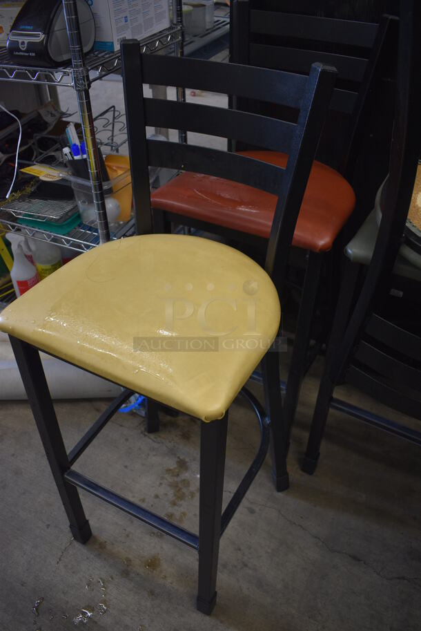 2 Black Metal Bar Height Chairs; Yellow and Red Seat Cushions. 17x18x44. 2 Times Your Bid! - Image 2 of 4