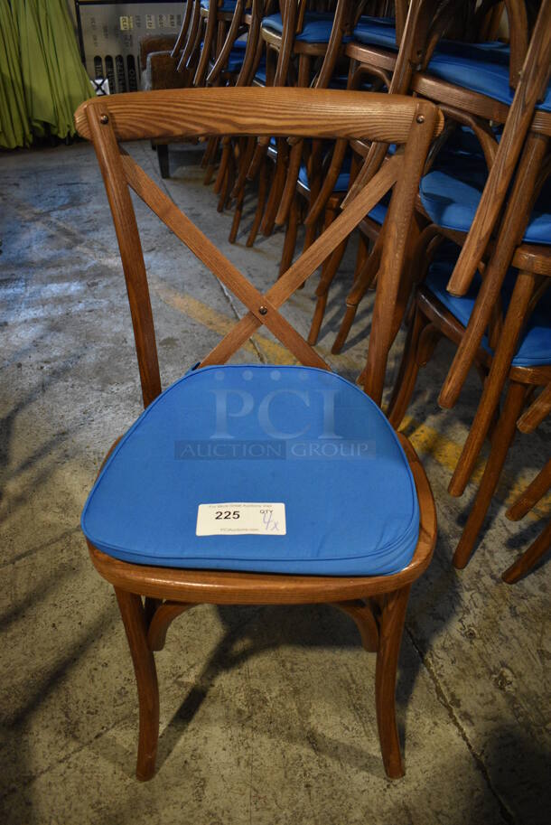 4 Wooden Dining Chairs w/ Blue Seat Cushion. Stock Picture - Cosmetic Condition May Vary. 20x18x35. 4 Times Your Bid!