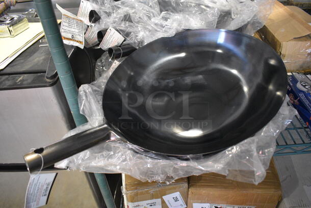 12 BRAND NEW! Winware WOK-16 Metal Skillets. 22x16x5. 12 Times Your Bid!