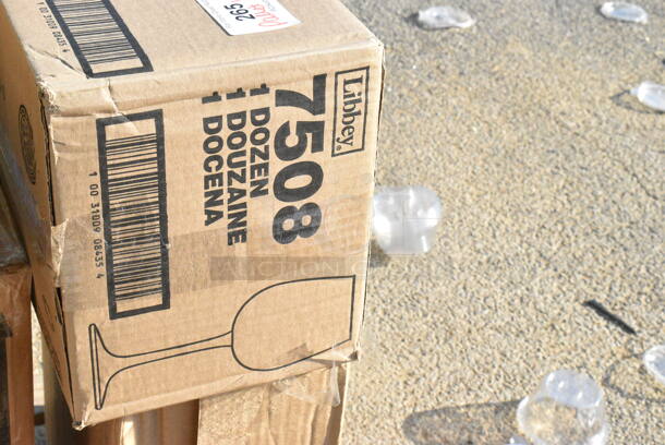 9 BRAND NEW Boxes Including 164TB2222 Lancaster Table & Seating 22" x 22" Cross Cast Iron Table Base Plate, 808B1449ACD Superlevel Self Adjusting Table Foot - 4/Pack, 407KRPLAS13 Choice 13-Slot Plastic Wall Mount Knife Rack, 2 Box Libbey 7508 Vina 12.75 oz. Customizable Tall Wine Glass - 12/Case, 117321310 AllPoints 32-1310 5' x 1/2" ID Fryer Oil Filter Hose, 4558022026 32 oz. Tall Plastic Iced Tea Design Souvenir Cup with Straw and Lid - 200/Case. 9 Times Your Bid!  - Image 7 of 11