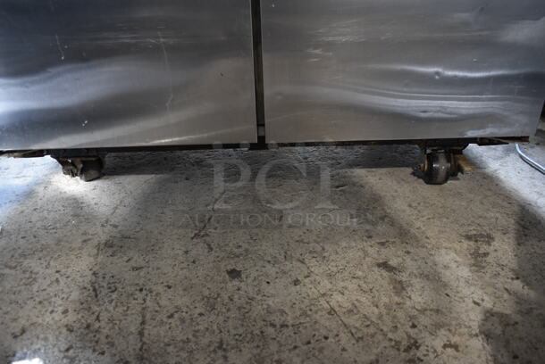 2012 True TG2R-2S ENERGY STAR Stainless Steel Commercial 2 Door Reach In Cooler w/ Poly Coated Racks on Commercial Casters. 115 Volts, 1 Phase. Tested and Working! - Image 5 of 9