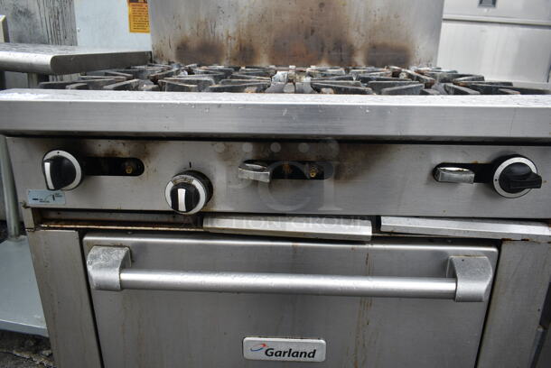 Garland G36-6R Stainless Steel Commercial Natural Gas Powered 6 Burner Range w/ Oven and Back Splash.  - Image 5 of 8