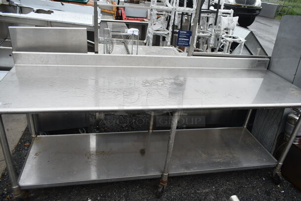 Eagle Stainless Steel Commercial Table w/ Back Splash and Under Shelf on Commercial Casters. - Item #1113492