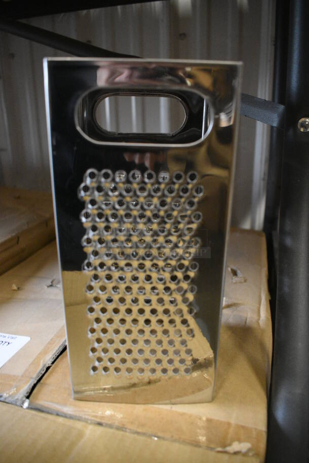 4 BRAND NEW! Metal Graters. 4 Times Your Bid!