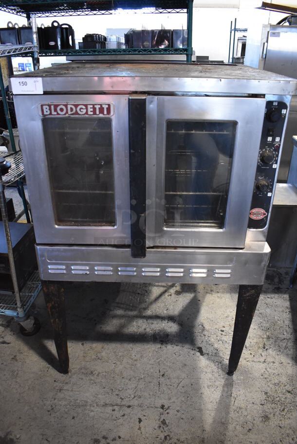Blodgett Stainless Steel Commercial Gas Powered Full Size Convection Oven w/ View Through Doors, Metal Oven Racks and Thermostatic Controls on Metal Legs. 38x39x58