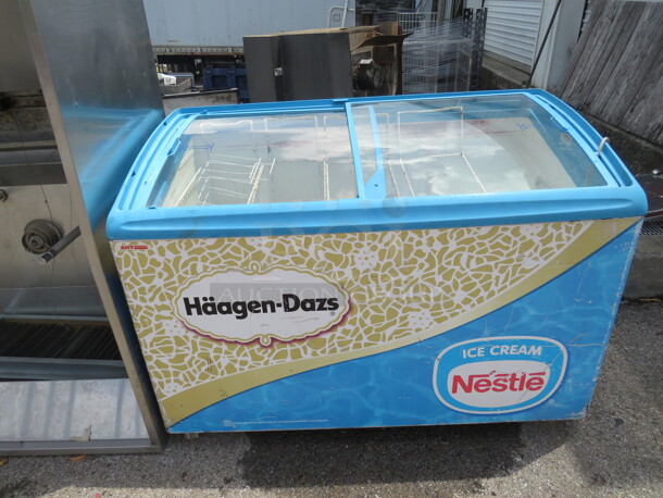 One AHT Reach In Display Freezer On Casters. 120 Volt. Model# RIO S 125UL. 48X26X35. Not Cooling. - Image 1 of 2