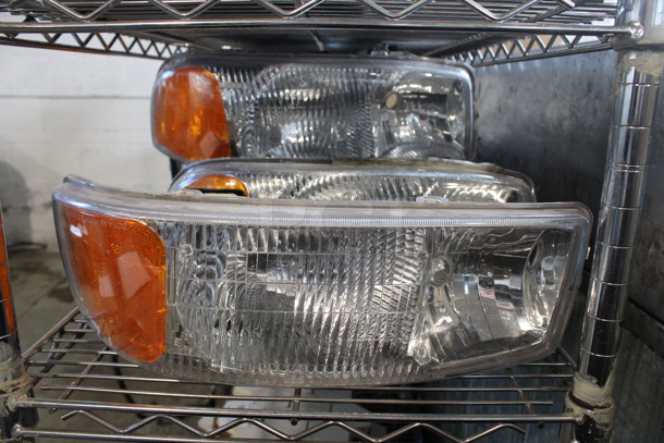 6 Various Headlights. Includes 17x7x6. 6 Times Your Bid!
