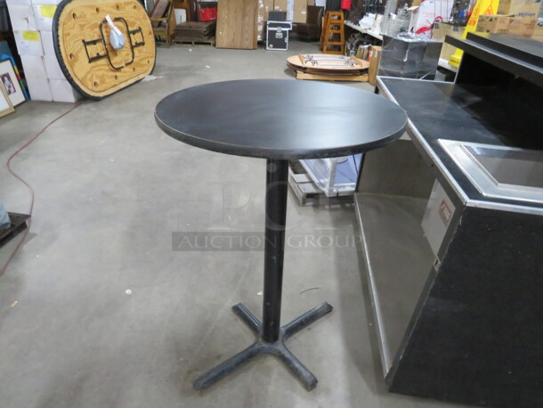 One Black Laminate Table Top On A Bar Height Pedestal Base. 