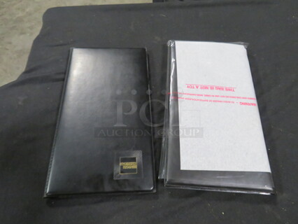 One Lot Of 11 Check Holders.