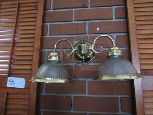 One Wall Mount Dual Light Fixture With 2 Glass Globes. BUYER MUST REMOVE!