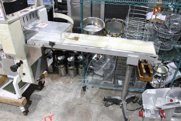 PFM Packaging 30 M Metal Commercial Floor Style Horizontal Form Fill and Seal / Horizontal Flow Wrapper Machine on Commercial Casters. 220 Volts, 1 Phase.  - Image 2 of 11