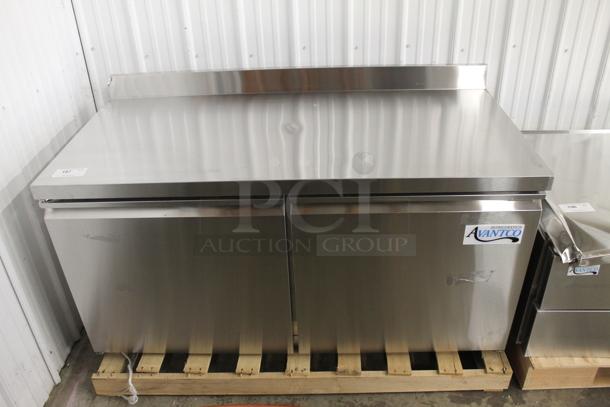 BRAND NEW SCRATCH AND DENT!  Avantco 178SSWT60FHC Commercial Stainless Steel Two Door Worktop Freezer With Backsplash, Polycoated Racks And Commercial Casters. 115V. Tested and Working!