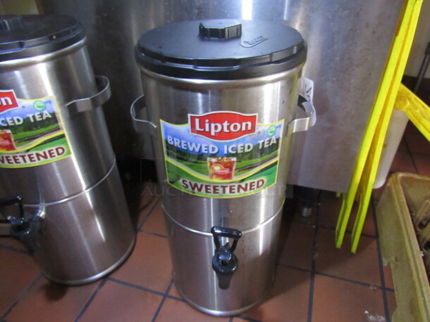 One Stainless Steel Tea Dispenser With Spigot And Lid.