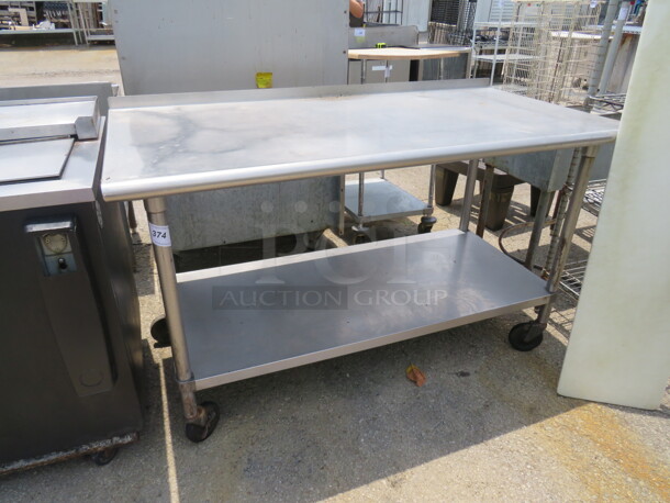 One Stainless Steel Table With SS Under Shelf On Casters. 60X30X38 - Image 1 of 1