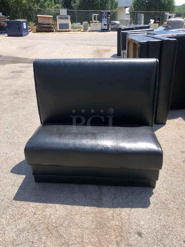 One Single Sided Booth With Black Cushioned Seat And Back. 48X25X43