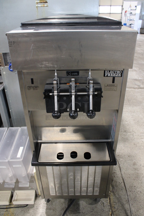 2013 Electro Freeze Model SL500-132 Stainless Steel Commercial Water Cooled Floor Style 2 Flavor w/ Twist Soft Serve Ice Cream Machine on Commercial Casters. 208-230 Volts, 3 Phase. 22x32x59
