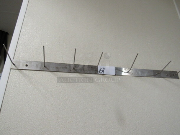 One Wall Mount Stainless Steel Holder With 6 Holders. BUYER MUST REMOVE. 