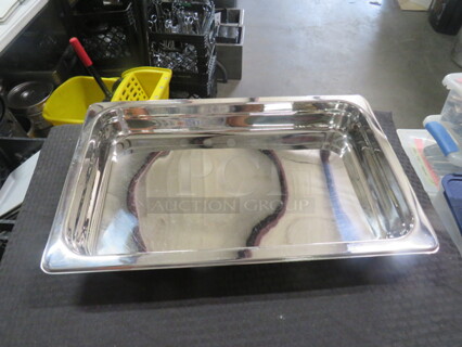One Full Size 2.5 Inch Deep Hotel Pan. Looks NEW.
