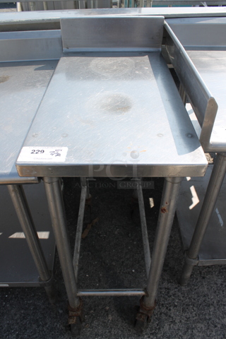 Stainless Steel Commercial Table w/ Back Splash and Under Shelf on Commercial Casters.
