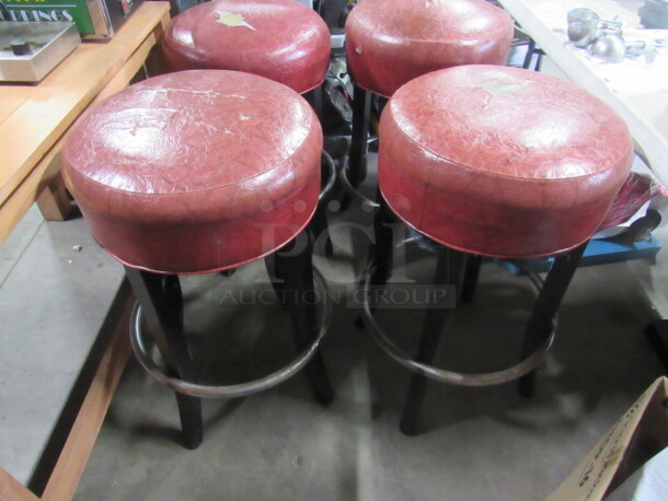 Bar Stool With A Red Cushioned Seat And Footrest. 2XBID