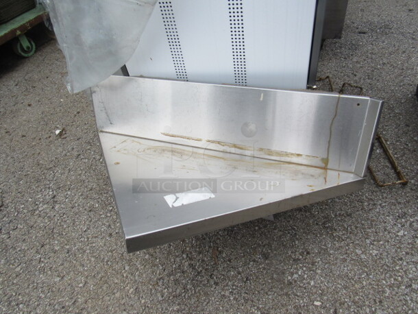 One Stainless Steel Corner Shelf With Back Splash. 35X20