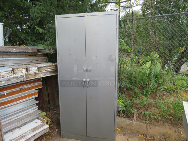 One Tennsco 2 Door Metal Cabinet. 36X18X78
