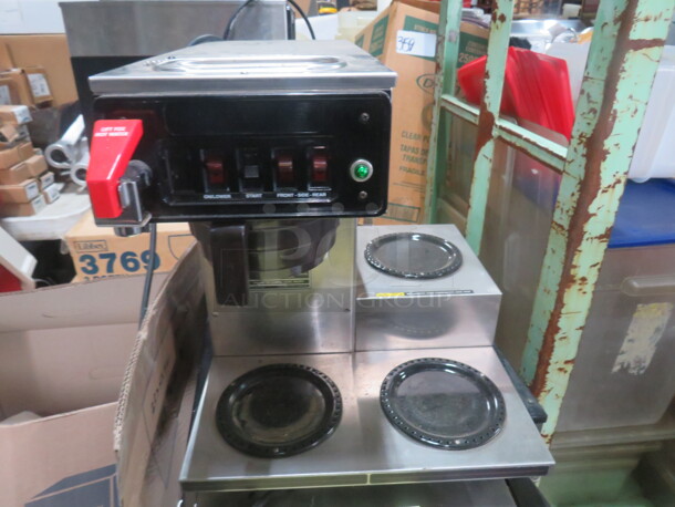 One Bunn Coffee Brewer With Filter Basket And Dual Warmers. 120 Volt. 16X18X17