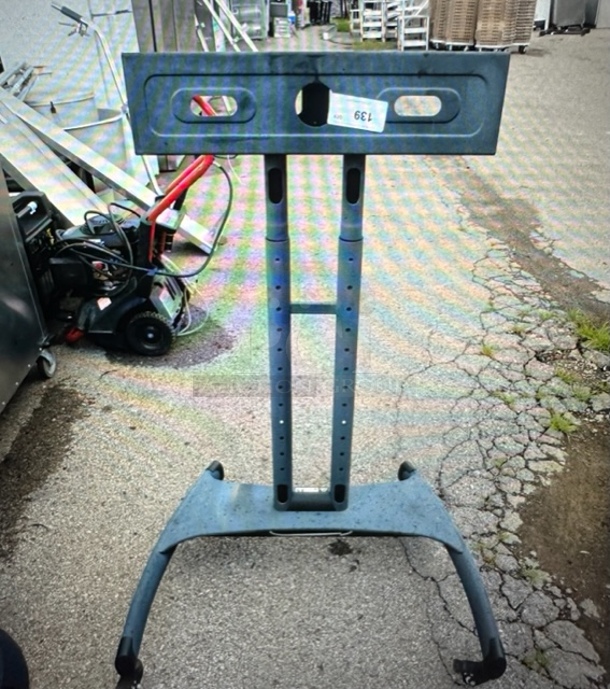 One Metal TV Stand On Casters. 32X29X49.5. - Image 1 of 1