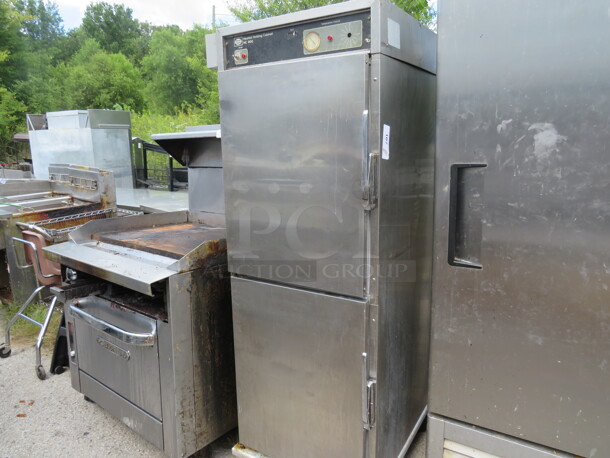 One Stainless Steel Henny Penny Holding Cabinet, On Casters. Missing 1 Knob. Model# HC900. 26.5X30X70 - Image 1 of 1